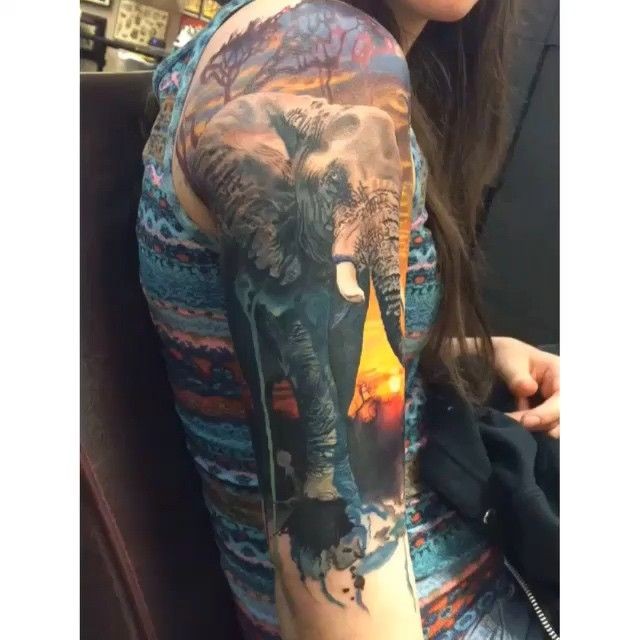 Realism style colored shoulder tattoo of large elephant