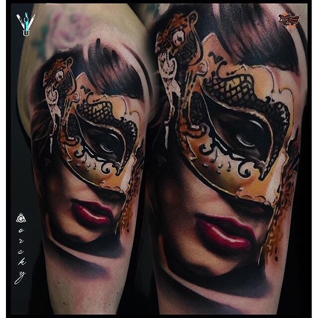 Realism style colored shoulder tattoo of mystical woman with mask