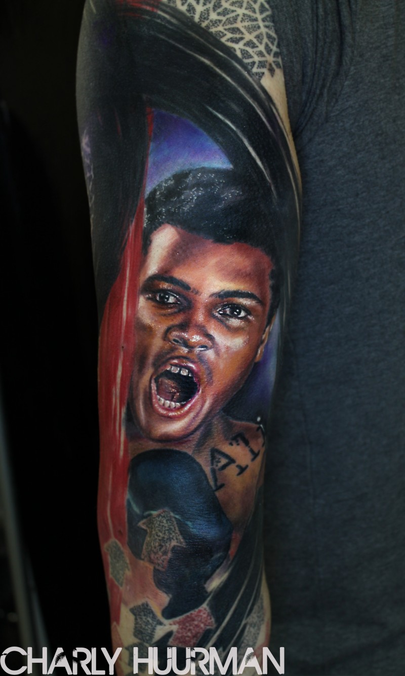 Realism style colored sleeve tattoo of Muhammad Ali portrait