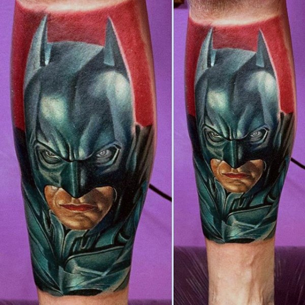Realism style colored tattoo of angry Batman face