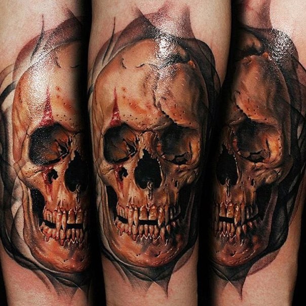 Realism style colored tattoo of bloody ancient skull