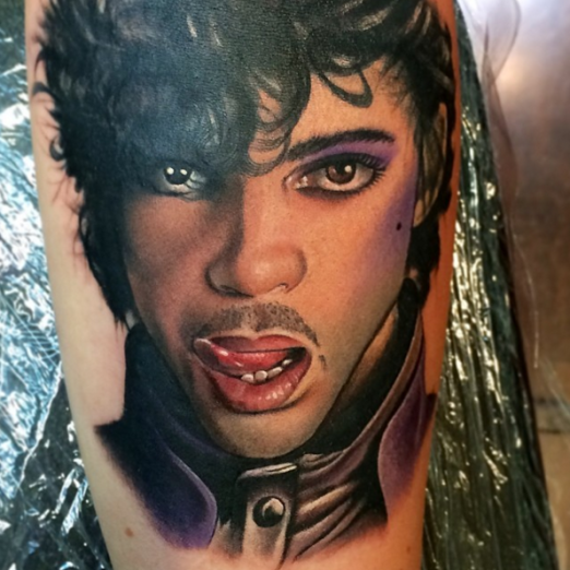 Realism style colored tattoo of famous Prince singer portrait