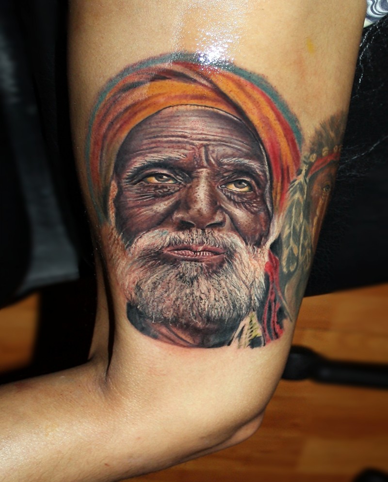 Realism style colored tattoo of old man with beard
