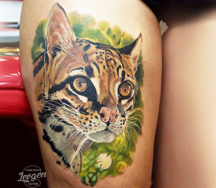 Realism style colored thigh tattoo of leopard head