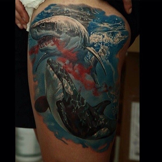 Realism style colored thigh tattoo of bloody whale and shark