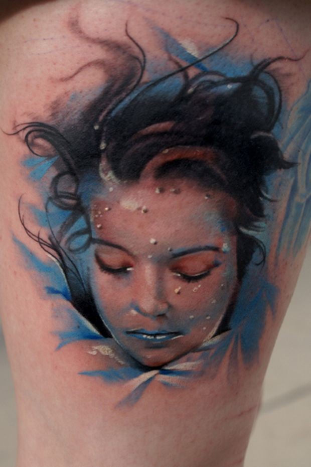 Realism style colored thigh tattoo of drowned woman
