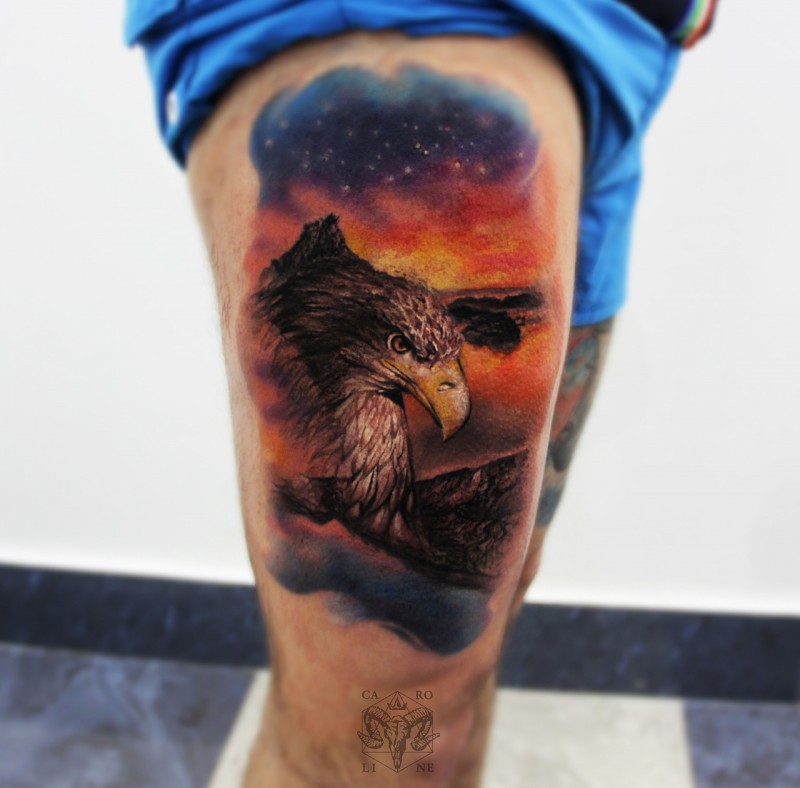 Realism style colored thigh tattoo of big eagle in night sky