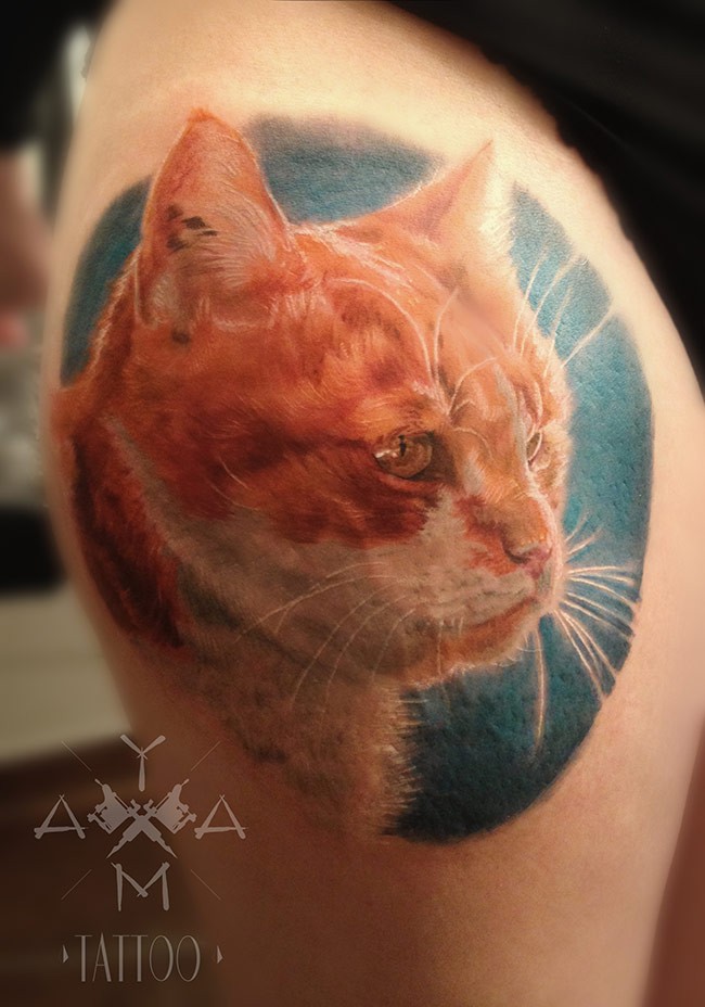 Realism style colored thigh tattoo of cat head