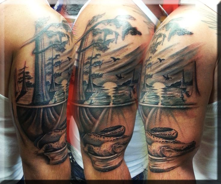 Realism style detailed shoulder tattoo of fores river with alligator