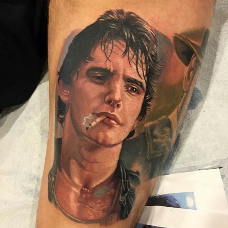 Realism style interesting colored leg tattoo of smoking man portrait