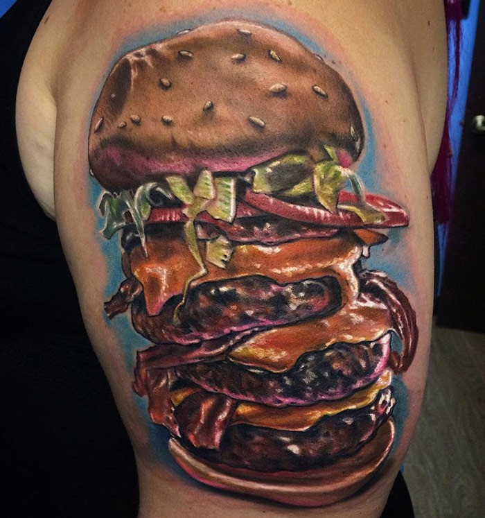 Realism style large very detailed shoulder tattoo of enormous burger