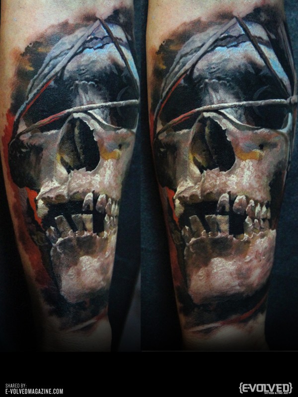 Realism style mystical looking human skull tattoo stylized with dark triangle