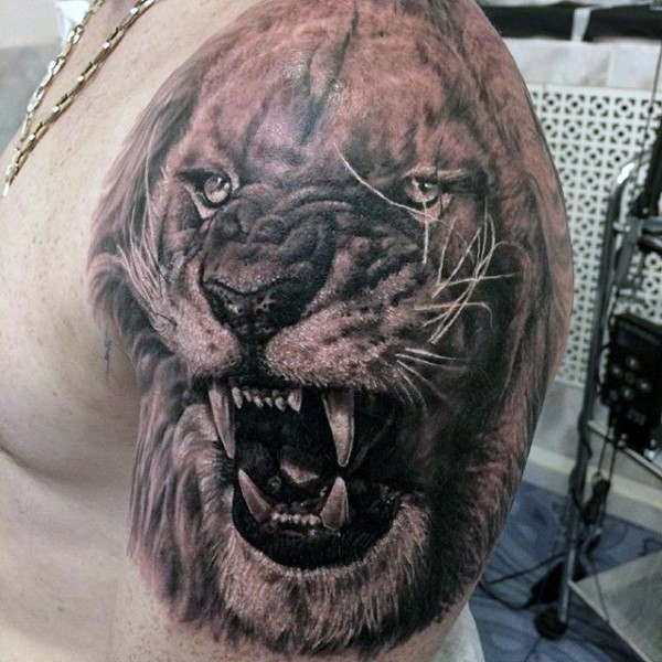 Realism style very detailed shoulder tattoo of roaring lion