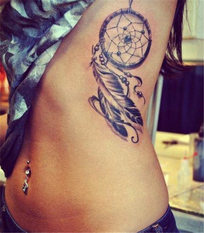 Realism style very detailed side tattoo of dream catcher