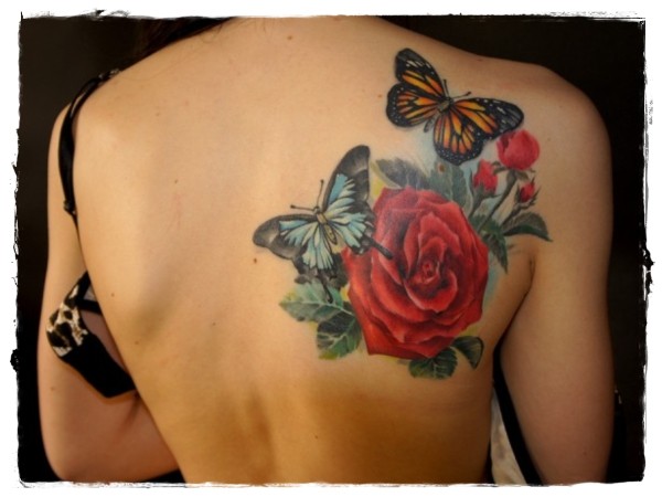 Realist multicolored nature tattoo with butterflies and flower on shoulder