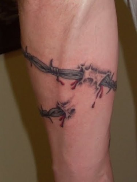 Realistic barbed wire forearm tattoo