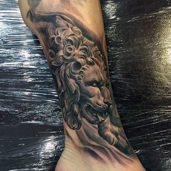 Realistic designed and painted leg tattoo of stone lion statue