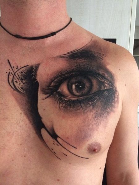 Realistic eye tattoo on chest for men