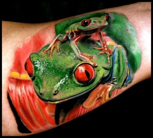Realistic green frogs tattoo by andrea afferni