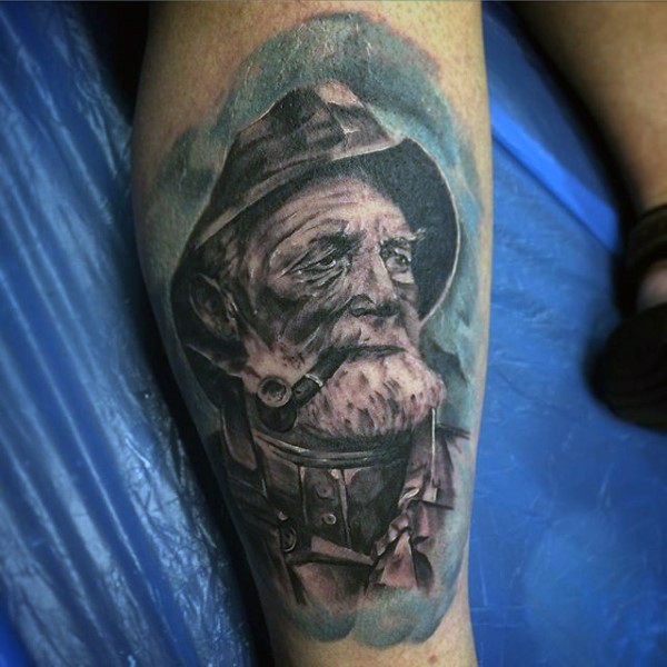 Realistic looking black and white old sailors portrait tattoo on leg