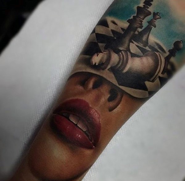 Realistic looking colored arm tattoo of woman leaps and chess