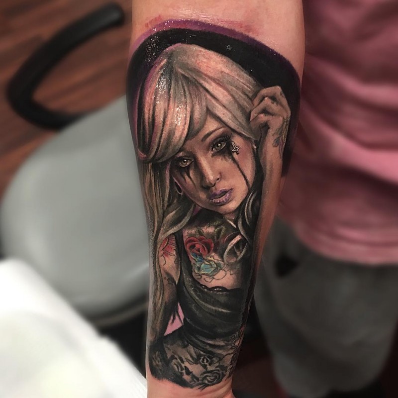 Realistic looking colored forearm tattoo of mystical woman