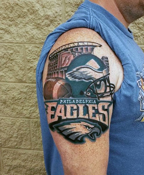 Realistic looking colored shoulder tattoo of sports team emblem