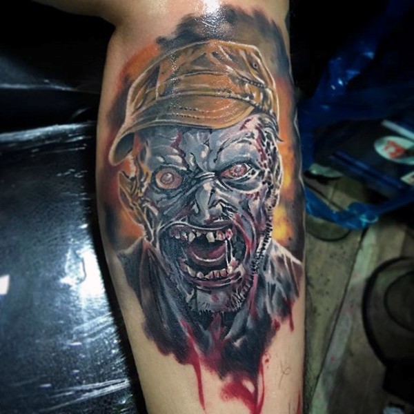 Realistic looking creepy bloody zombie face tattoo on arm