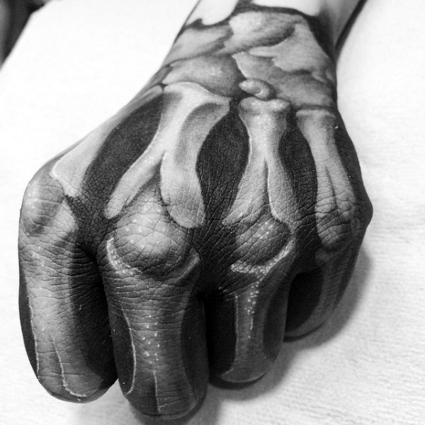 Realistic looking detailed hand tattoo of human bones