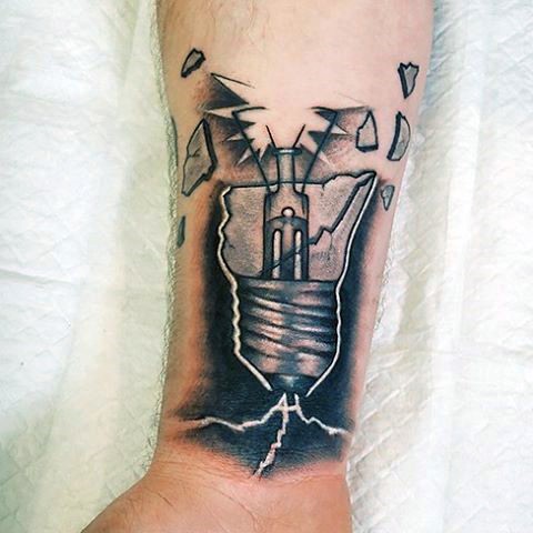 Realistic looking forearm tattoo of broken bulb