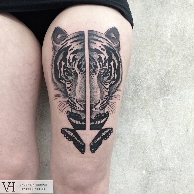 Realistic looking made by Valentin Hirsch black ink thigh tattoo with butterfly wings
