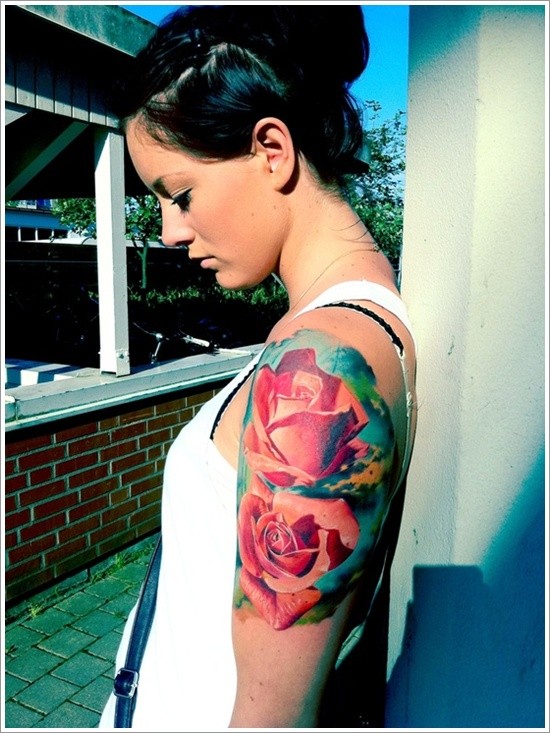 Realistic looking massive roses tattoo on shoulder