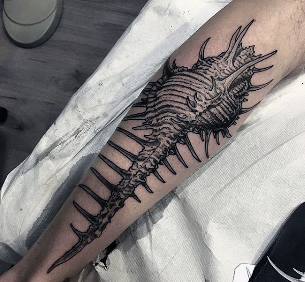 Realistic looking painted in dotwork style tattoo of creepy animal skeleton