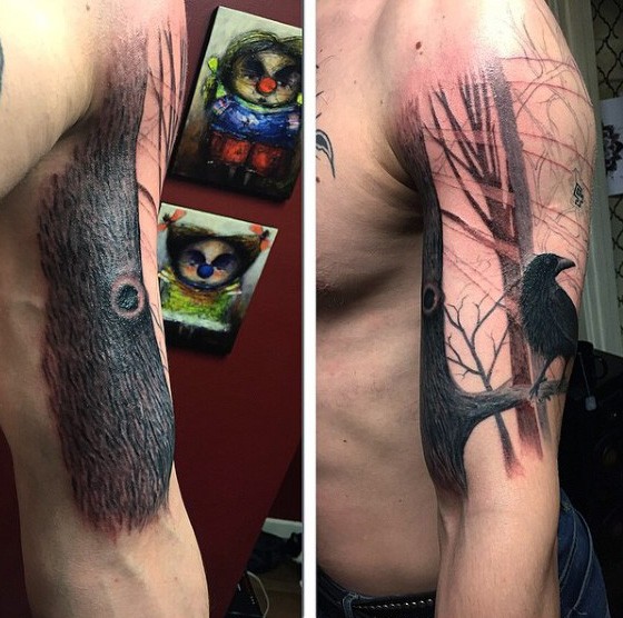 Realistic looking shoulder tattoo of big tree with crow