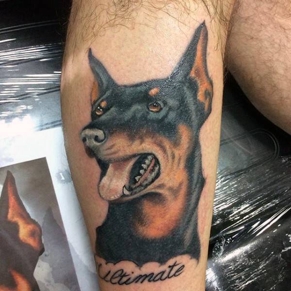 Realistic naturally colored Doberman portrait tattoo with lettering