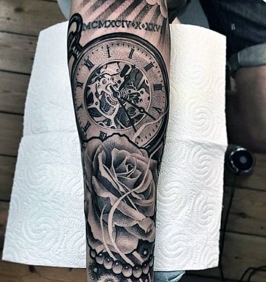 Realistic photo like black ink old mechanic clock with flower tattoo on sleeve