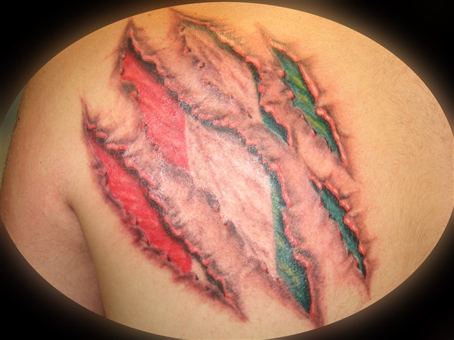 Realistic ripped skin italian flag tattoo