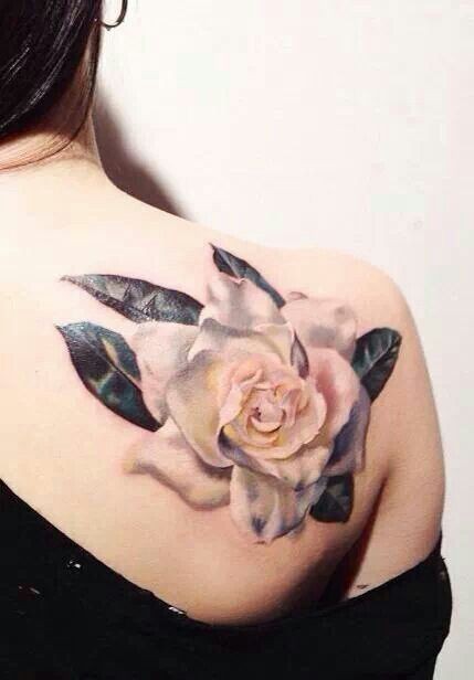 Realistic white rose tattoo on shoulder