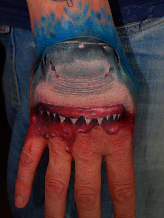 Realistic shark movie tattoo on hand