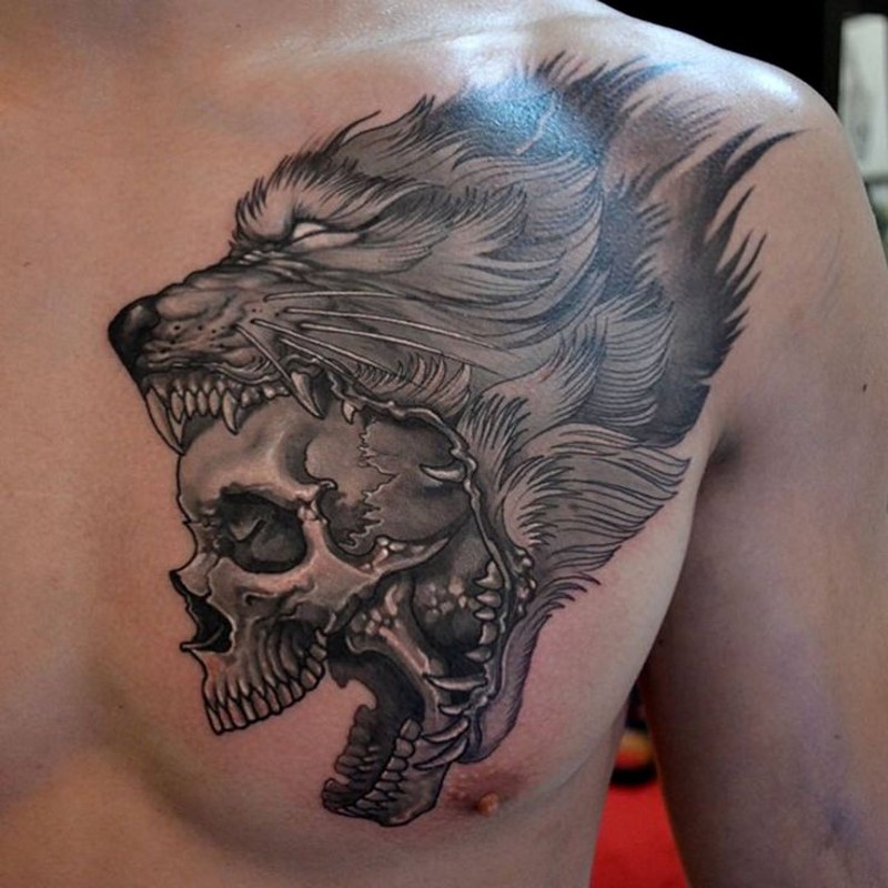 Realistic skull in jaws of wolf tattoo on chest