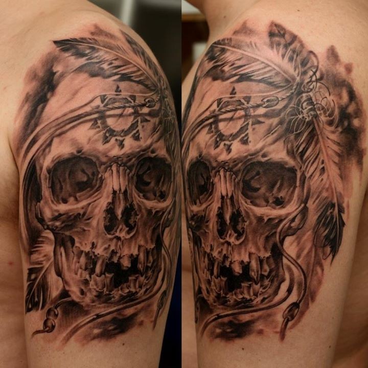 Realistic skull with native american symbols tattoo on shoulder