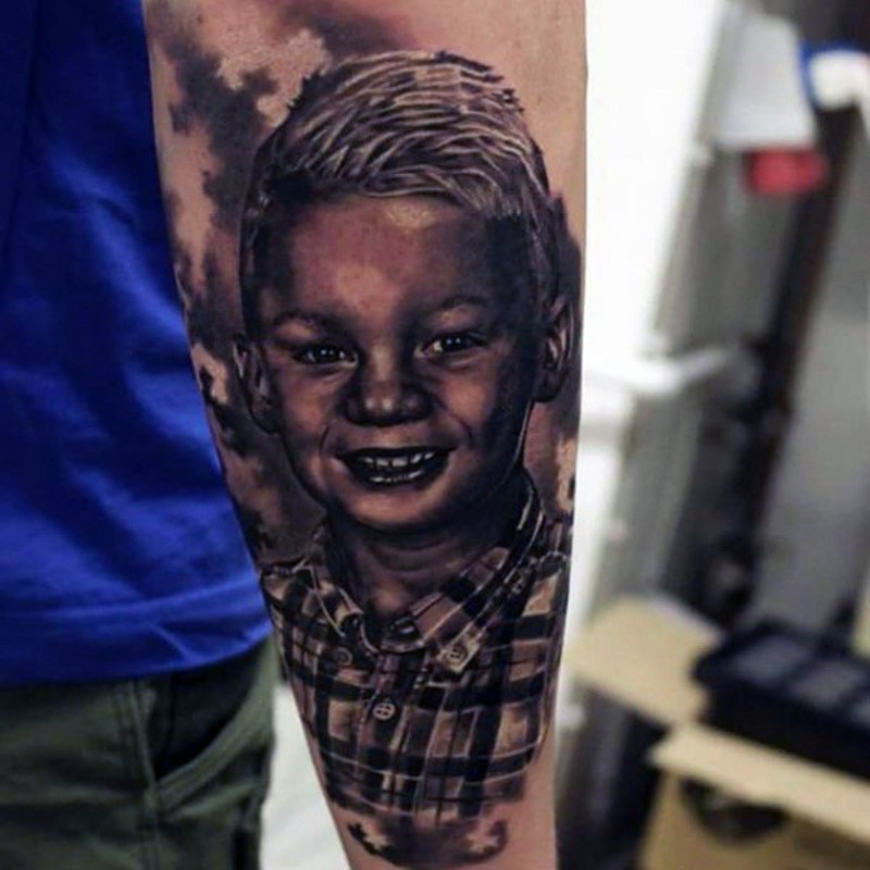 Reals photo like black and white little boy portrait tattoo on arm