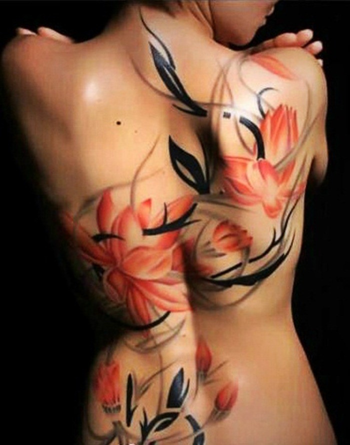 Red and black flowers tattoo on whole  back