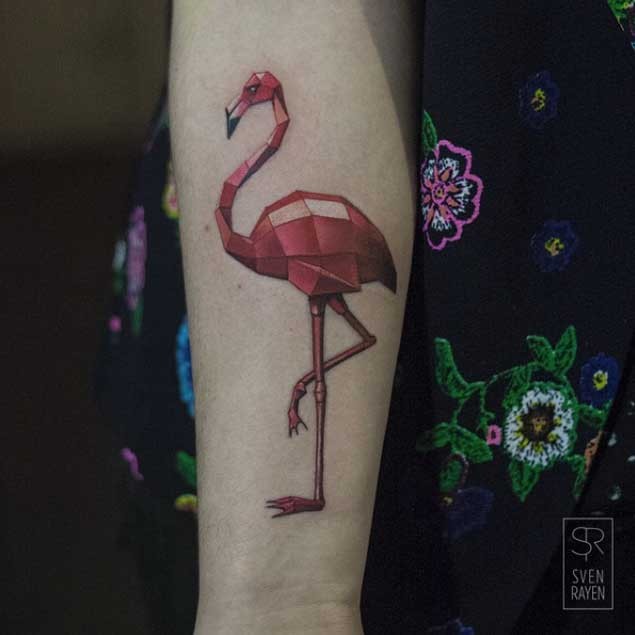 Red colored forearm tattoo of big flamingo