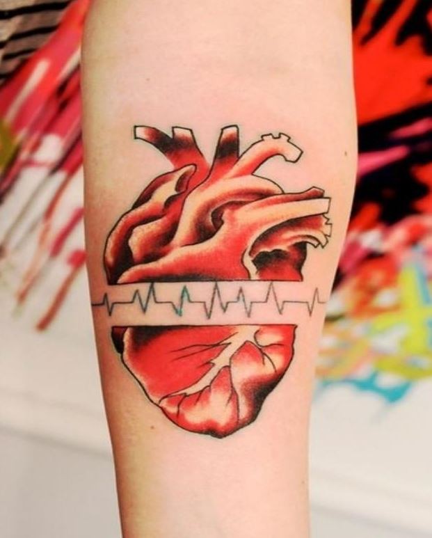 Red heart with pulse tattoo on arm