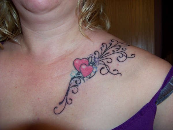 Red hearts with stars tattoo