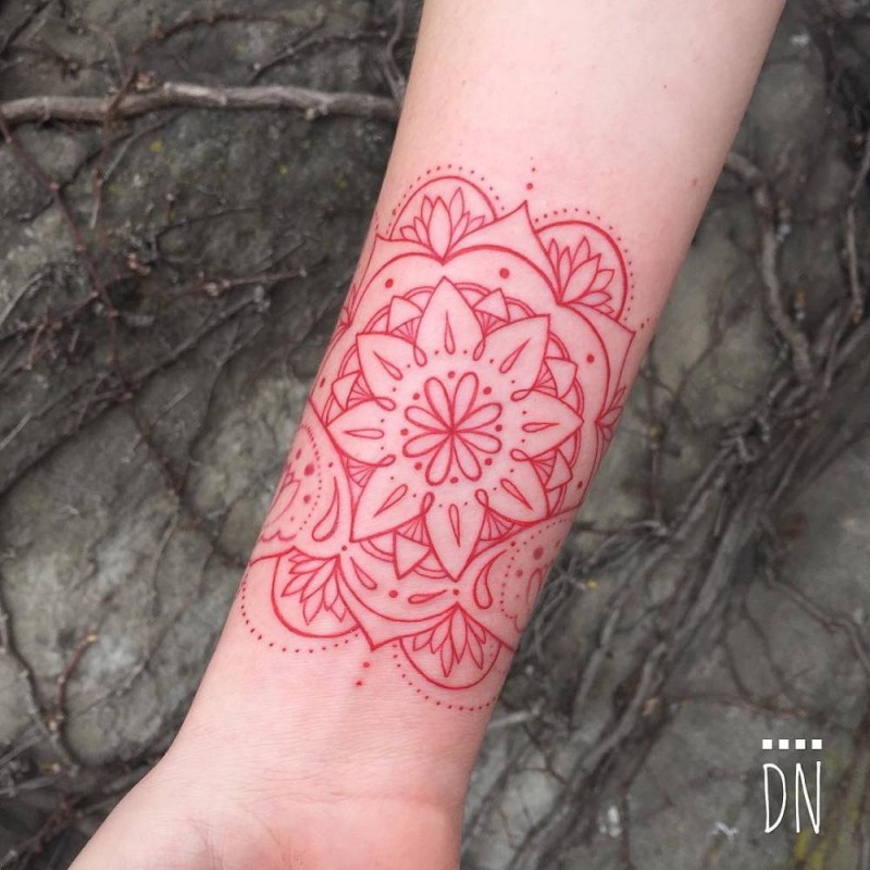 Red ink colored by Dino Nemec forearm tattoo of beautiful flower