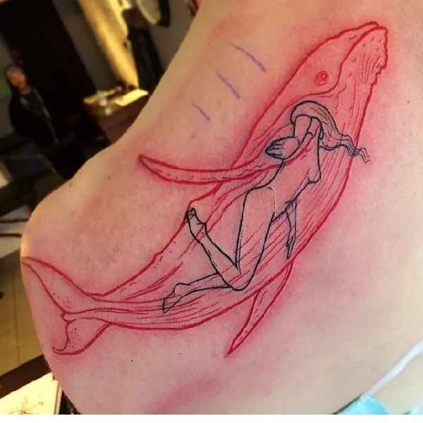 Red ink style colored whale tattoo with swimming
