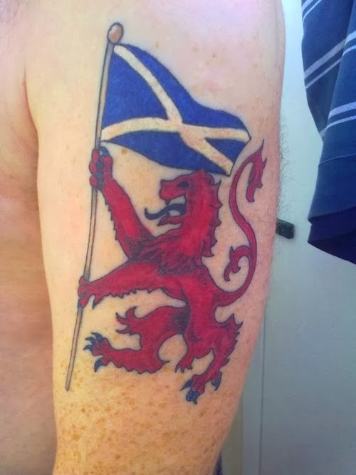 Red lion with blue flag scotland tattoo