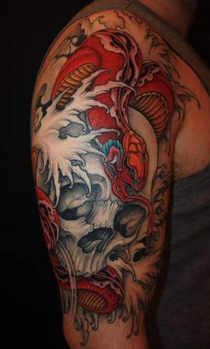 Red snake on skull in sea  tattoo on arm